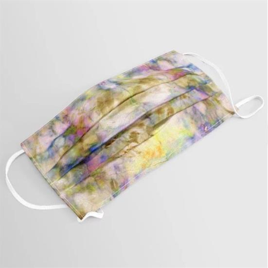 A cloth face mask featuring a pleated design and filter pocket, with an opal dyeblot color pattern.