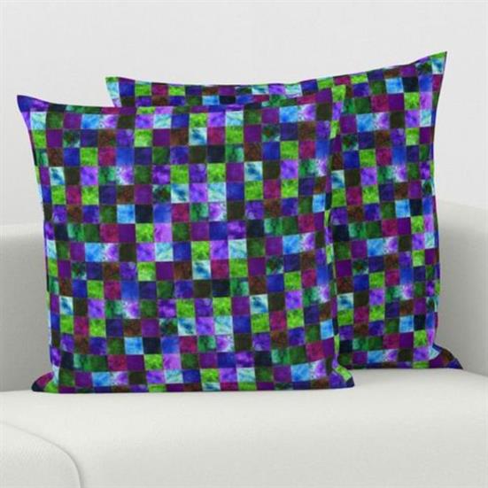 Two pillow covers featuring a block quilted design in blues, greens and purple.