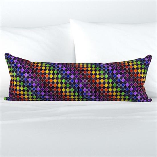 A long lumbar pillow cover in a rainbow and black arabesque pattern.