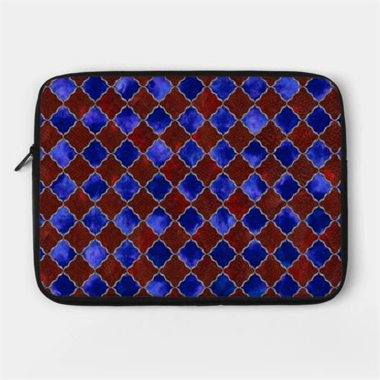 A laptop case with a blue, burgundy, and silver arabesque design.